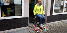 Rita Ebel tests her wheelchair ramp by Lego. Photo